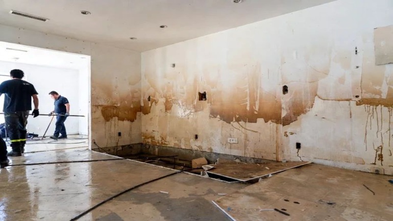Flood damage cleanup process inside a residential property affected by water intrusion